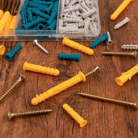 270 Pcs Drywall Anchors and Screws Assortment Kit with 135 Plastic Expansion Wall Anchors and 135 Phillips Flat Head Wood Screws in 5 Common Sizes on a wooden surface.