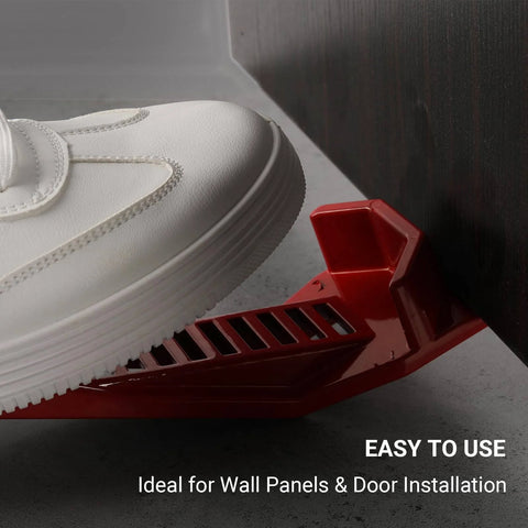 Close-up of red XL Sheetrock Kicker in use, part of (2-Pack) XL Drywall Lift & Sheetrock Kicker Multi-Tool Set with Built-In Drywall Rasp Tool & Bottle Opener
