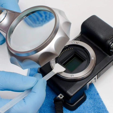 Full Frame Sensor Cleaning Swabs 24mm For DSLRs And SLRs 20 Pack HCS 24 used with magnifying glass on camera sensor