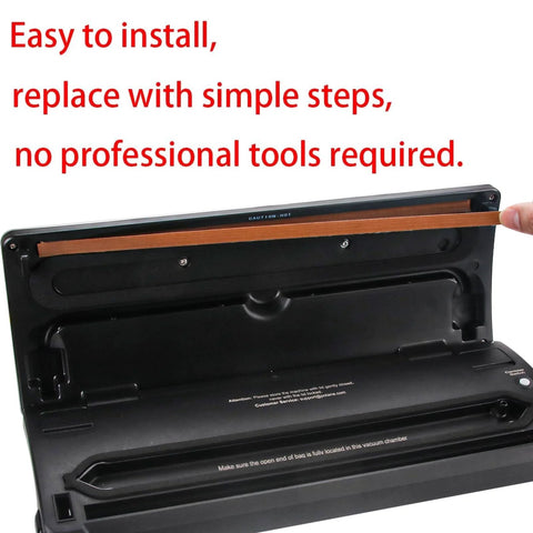Vacuum sealer with lid open, black kitchen appliance showing interior chamber and sealing bar.
