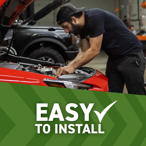 Person installing Silicone Induction Hose for Toyota Tacoma 3.5L 2016 2023 Direct Fit Black 4 Ply Silicone in engine bay.