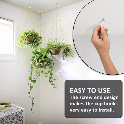 Hand installing cup hook in wall with three hanging plants shown, featuring easy-to-use design.