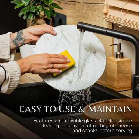 12 inch acacia wood lazy susan turntable with removable glass plate being cleaned under water.