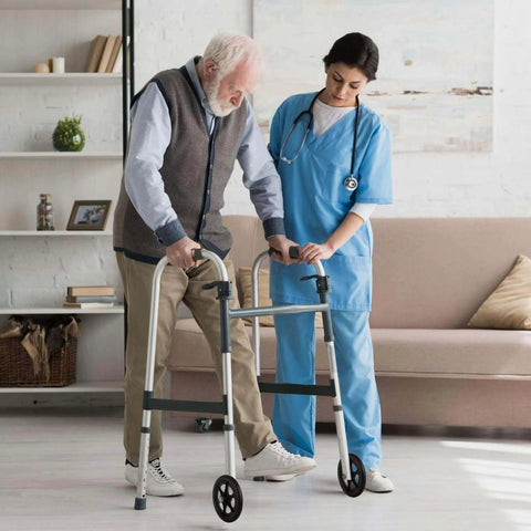 Elderly man using walker with 2Pcs 8 Inch Walker Wheels Replacement, assisted by nurse, indoors