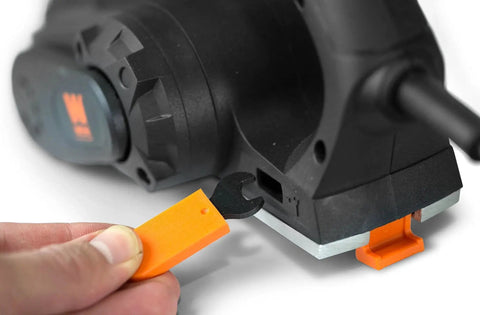 Side view of a powerful 3.8 Amp electric hand planer with a 2-3/8 inch width and plastic adjustment tool, showing depth adjustment.