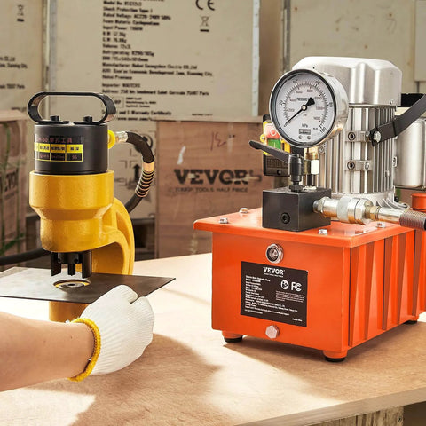 Electric Hydraulic Pump, 10000 PSI 750W 110V, 488 in³/8L Capacity in use for metal punching, with manual valve and lever switch.