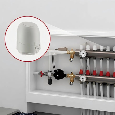 2W normally closed 24V electric thermal actuator, white, mounted on an underfloor heating manifold (IP54)