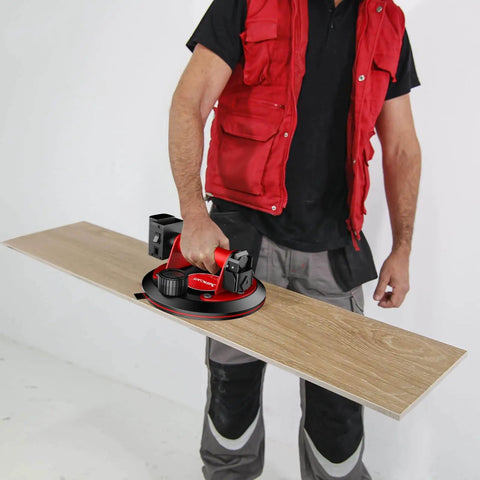 Person using an 8-Inch Glass Suction Cup With Metal Handle, Electric Vacuum Lifter Clamp to lift a wooden panel