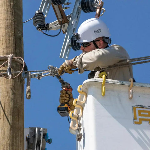 Electrician using Three In One Impact Socket With 12 Point Deep Design, Dual Hex Sizes Three Quarters Inch And Nine Sixteenths Inch on pole