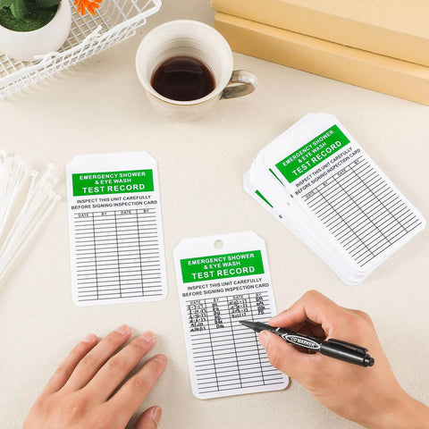 Person marking Emergency Shower And Eyewash Inspection Tags Set with 30 Double Sided Record Tags and 30 Zip Ties and Marker visible.
