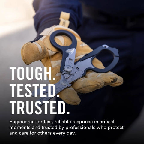 Raptor Rescue 6-in-1 Heavy-Duty Emergency Trauma Shears With Included Utility Holster Made In USA Built For Quick Rescue And Grab-And-Go Everyday Tough Situations Anywhere held by gloved hand