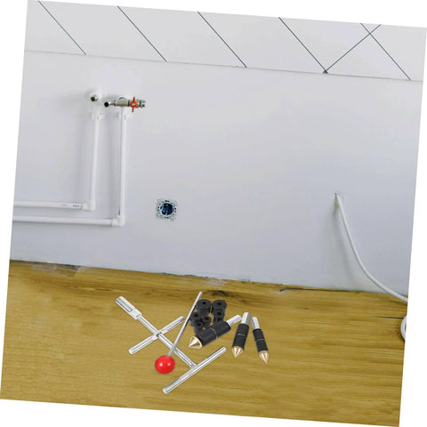 Emergency Water Stopper Kit And Leak Repair Tool Set for plumbing DIY; tools shown on wooden surface near wall pipes.