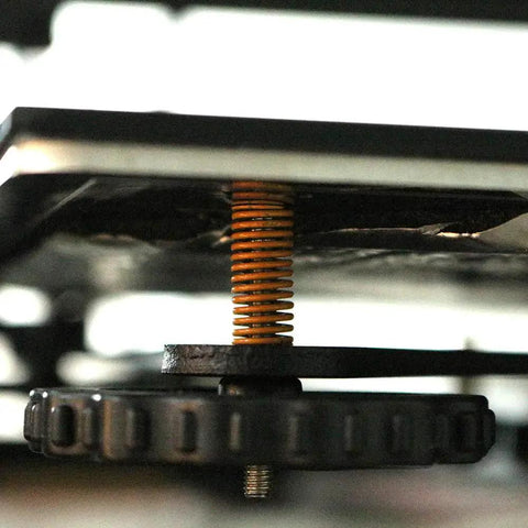 Close-up of Ender 3 Bed Leveling Springs Pack Of 10 By FYSETC 8mm OD 20mm Length Compression Die Springs under 3D printer bed