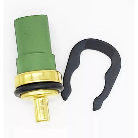 SCHUSSPART TS477 engine coolant temperature sensor, green plastic housing with brass tip and black retaining clip.
