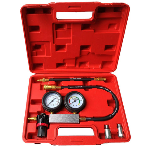 Engine cylinder leak tester set in a red case with dual gauges, hoses, and brass adapters.