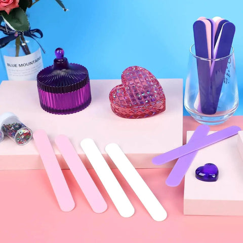 Epoxy Resin Stir Sticks Set 20 PVC Mixing Sticks In 4 Colors Reusable Plastic Stirrers on a tabletop scene