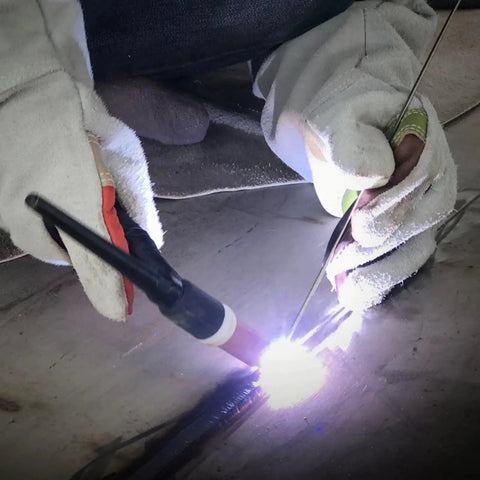 Close-up of welder using ER308L Stainless Steel TIG Welding Rod 1/16 x 16 Inches 5 Lb Pack for general purpose welding application