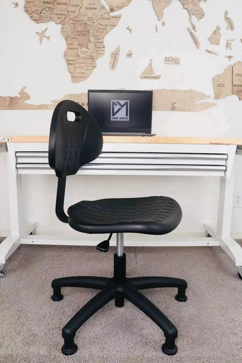 Side view of Table Height Chair Stool Deluxe Ergonomic Polyurethane Chair with 5 Inch Height Adjustment in an office setting