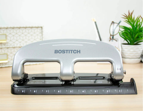 Front view of Bostitch EZ Squeeze 3 Hole Punch 20 Sheet Capacity No Jam Technology Reduced Effort Metal Body Integrated Ruler.