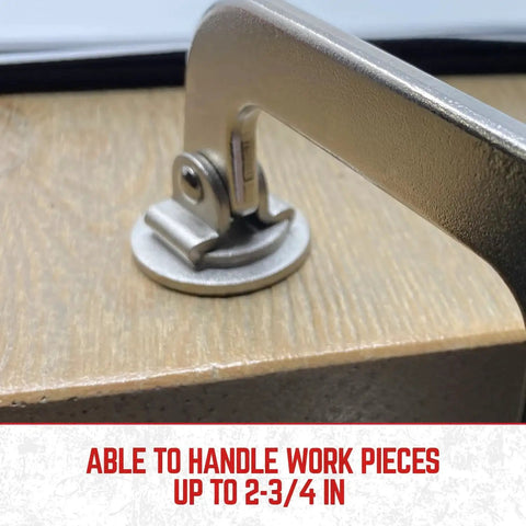 Close-up of heavy duty 3 inch face clamp showing steel construction and ergonomic grip on wood surface for woodworking projects.