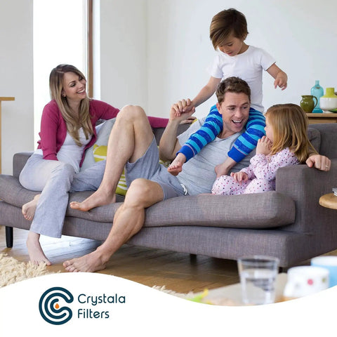 Family enjoying clean water with Crystal Filters product on living room sofa