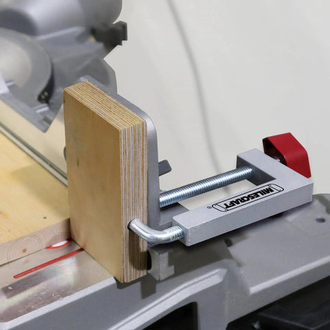 Universal Fence Clamp Set For Miter Saws And Router Tables Milescraft 7209 installed on miter saw with wooden block secured
