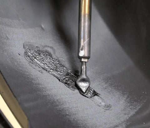 Close-up of Flat Ribbon Plastic Welding Rod Black 30 Ft used on plastic surface for ultra strong repairs with TPO carbon and glass fiber reinforcement
