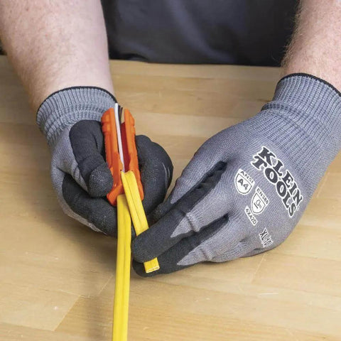 Hands using Five In One Cable Stripping Tool For 12 To 14 AWG NM Cable Jacket Slitting And Precision Insulation Stripping For 12 To 14 AWG Conductors