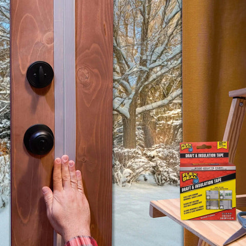 Applying Flex Seal Draft and Insulation Sealing Tape, 2 in x 16 ft, to a wooden door, with product box visible, snowy window view.