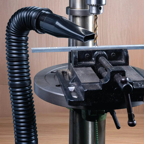 Screw End Quick Coupler For Two And A Half Inch Hose With Left Hand Threaded Adapter attached to shop vac near drill press