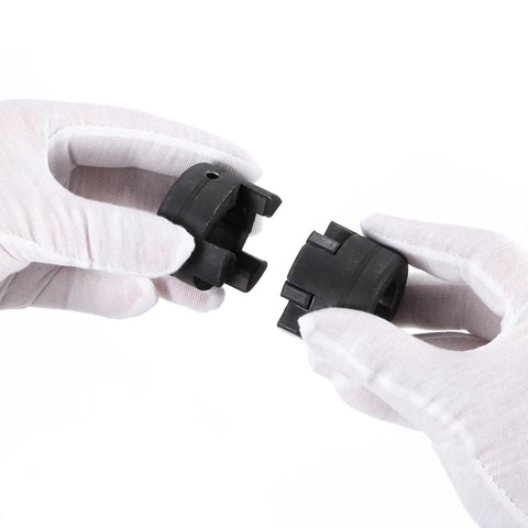 Hands holding a Flexible Three Piece L Jaw Coupling Set From One Half Inch To Seven Eighth Inch Bore With NBR Buna N Rubber Insert