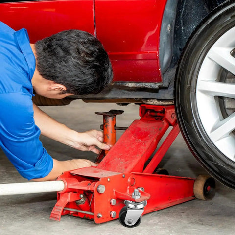 Mechanic using Heavy Duty 3 Ton Floor Jack Caster Wheels Cast Iron Replacement Parts Pack Of 2 With 16mm Stem Under Car