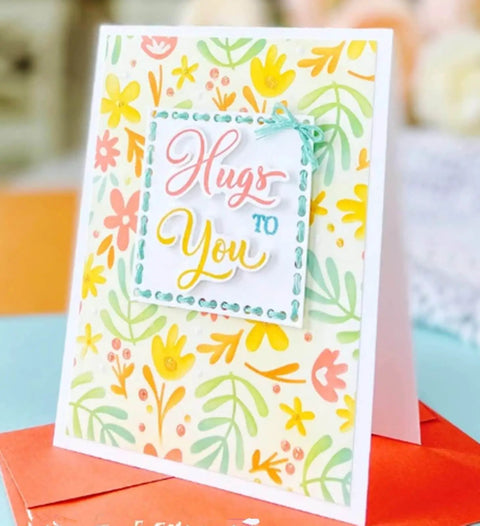 Colorful handmade card with 'Hugs to You' message, featuring floral design using Rectangular Frame Metal Die Cuts Set for Scrapbooking.