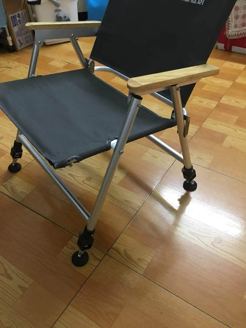 Chair on wooden floor using adjustable swivel feet levelers for stable height, featuring carbon steel with nylon base and rubber pad.