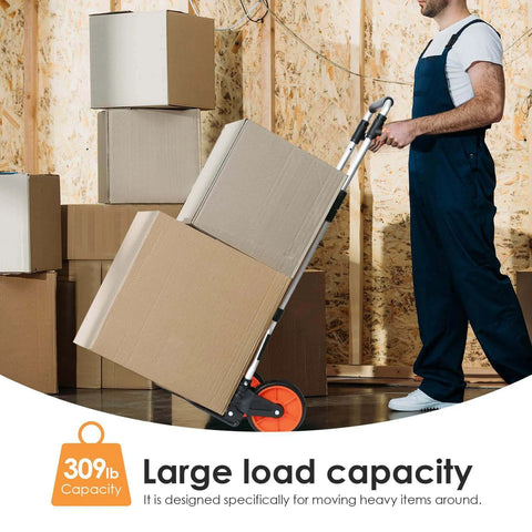 Man using 309 lb Aluminum Folding Hand Truck with Swivel Handle to move boxes, featuring 7-inch wheels for warehousing and shopping.