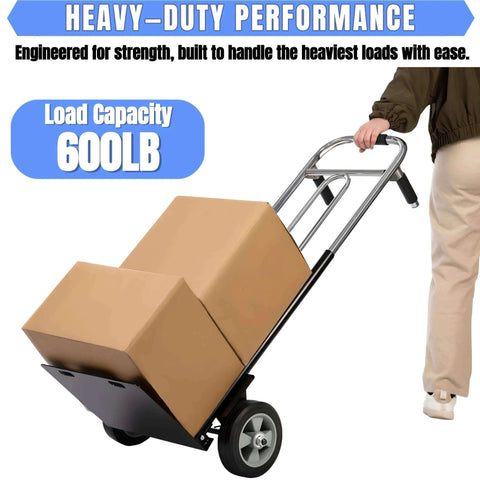 Person using ✝️ Folding Hand Truck Dolly - 600 LB Capacity with boxes, showcasing heavy-duty wheels in warehouse setting.