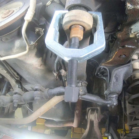 26554 Front End Service Kit in use, showing Pitman Arm Puller on vehicle suspension for maintenance and repair