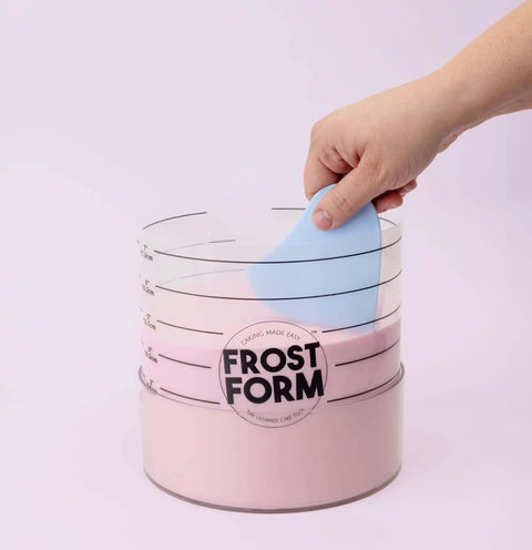 Hand using 6 Inch Frost Form Starter Kit For Cake Decorating 7 Piece Set With Liner Form Base Stand Crumb Cutter Finisher