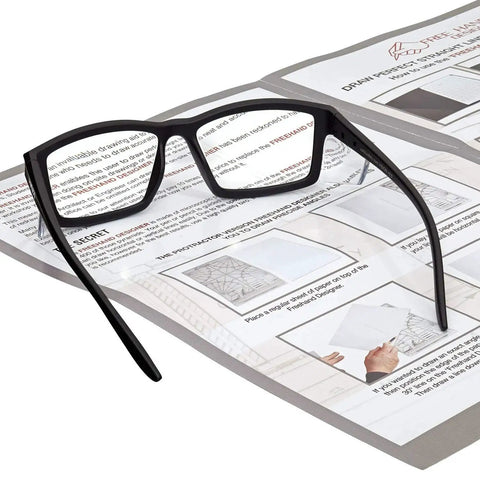 Full Lens Reading Safety Glasses 1.5 Diopter ANSI Z87.1 CE EN166F Anti Fog UV400 resting on instruction sheets