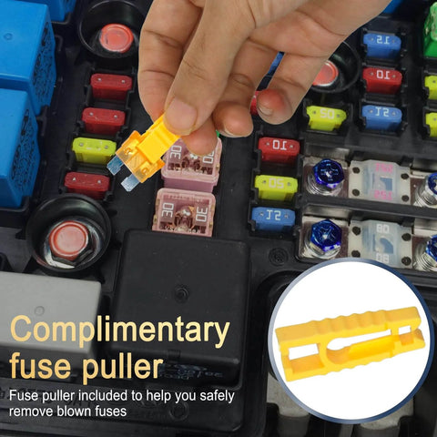 Hand using a yellow fuse puller to remove a fuse, part of the Ultimate Car Fuse Kit With 680 Mini Fuses 520 Standard Fuses And 132 Micro Fuses With Puller For RV Camper Truck Motorcycle Yacht 11 Amp Sizes From 2A To 40A For Quick Auto Electrical Fixes.