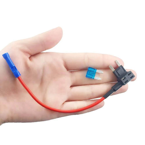 Hand holding a 5 Pack 12V Car Add A Circuit Fuse Tap Adapter Kit with 15 Amp Fuses and red wire for circuit expansion.