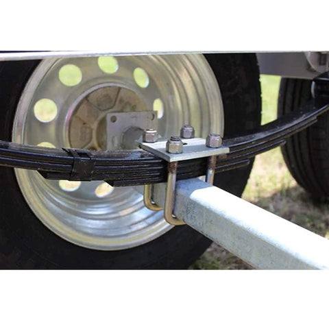 Heavy duty 1/2 inch galvanized U bolts and plate kit designed for boat trailer axles and leaf springs, rust resistant in saltwater or freshwater, universal 2x3 square axle fit, reliable marine trailer mounting hardware installed on a trailer.
