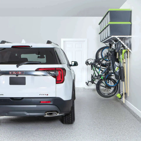 96 Inch Wide Wall Mounted Utility Storage Rack With 4 Bike Hooks And 20 Regular Hooks in a garage, holding bikes and tools