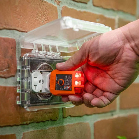 Infrared Thermometer and GFCI Receptacle Tester Kit in use testing electrical outlet safety