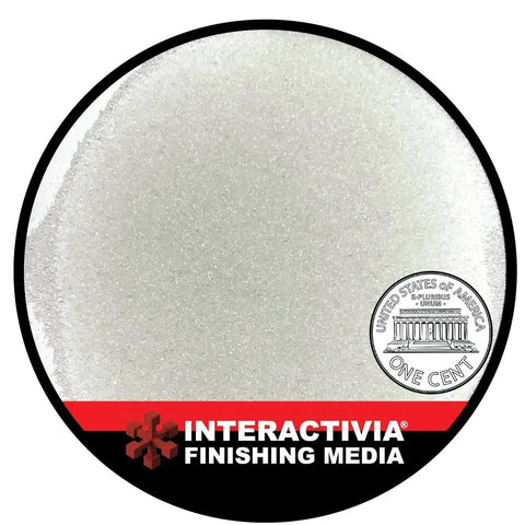 Glass Bead Blast Media For Precision Finishing Medium Grit 60 80 Mesh In An 8 Pound Bag 3.6 Kilograms displayed with a penny for scale.