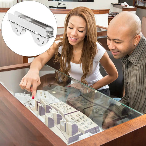 Sliding Door Roller Assembly With Nylon Wheel And Roller Stopper For Heavy Load Glass Showcases And Cabinet Doors Includes Floor Guide For Easy Installation And Smooth Low Noise Glide, with image of roller and people viewing jewelry inside a showcase.