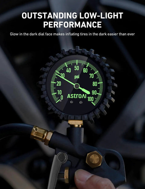 Tire Pressure Gauge With Inflator 0-100 PSI ANSI B40.1 Accuracy Large 2.5 Inch Glow Dial in use, showing glowing gauge needles and numbers close-up.