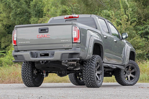 Rear view of a GMC pickup truck equipped with 4.5-8 Inch N3 Rear Shock Absorbers For 07-24 Chevy And GMC 1500 Pickup Trucks