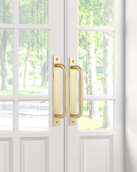 2 Pack Gold 7 Inch Barn Door Handles For Sliding Closet Doors With Backplates And Drawer Pulls installed on white doors
