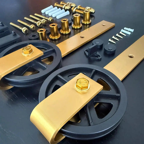 Components of Big Wheel Barn Door Hardware Kit For Sliding Track Set With Large Rollers And Gold Finish Handle Bar Finger Pull Plate And Floor Guide Heavy Duty Interior Closet And Room Doors Track Length Six Feet Door Not Included.